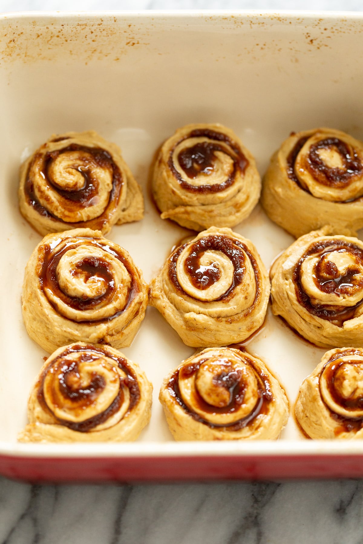 no yeast cinnamon rolls no yeast sweet potato cinnamon rolls in casserole dish ready to be baked