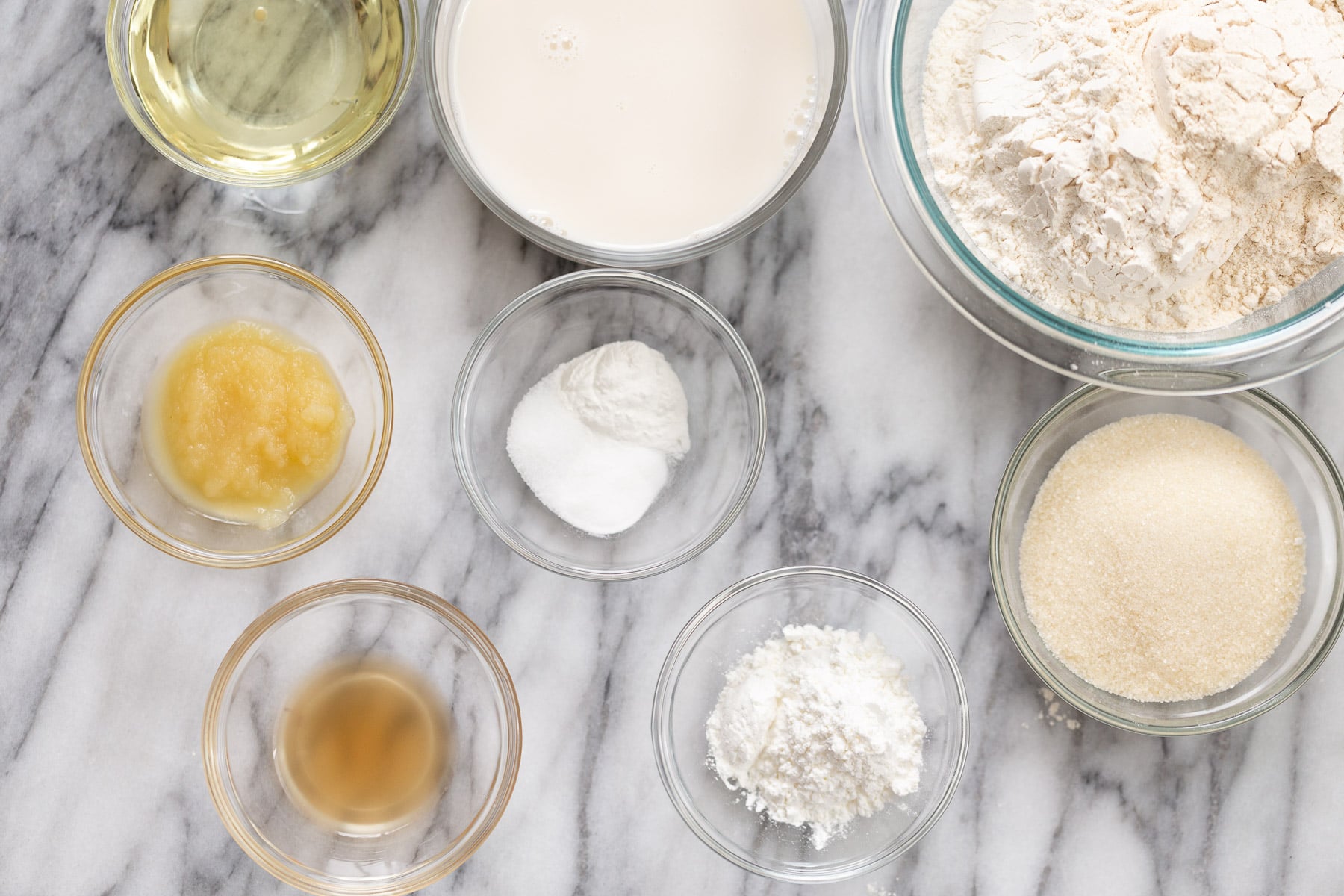 vegan white cake ingredients for making vegan white cake on a marble kitchen counter