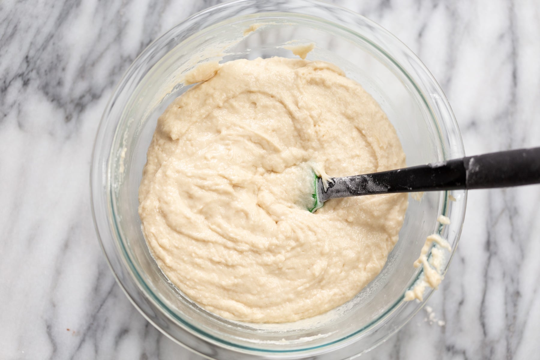 vegan white cake vegan white cake batter being mixed in a glass bowl