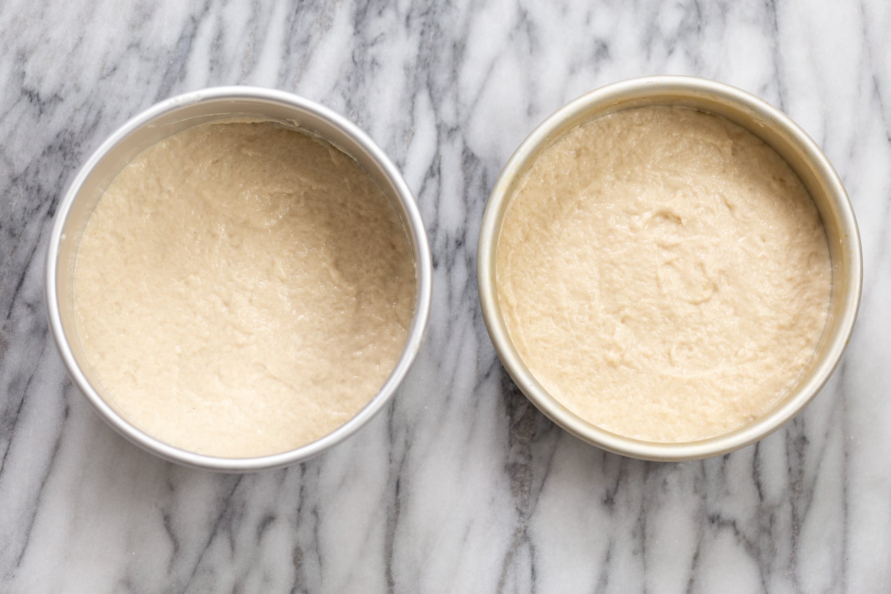 vegan white cake vegan white cake batter in two springform pans