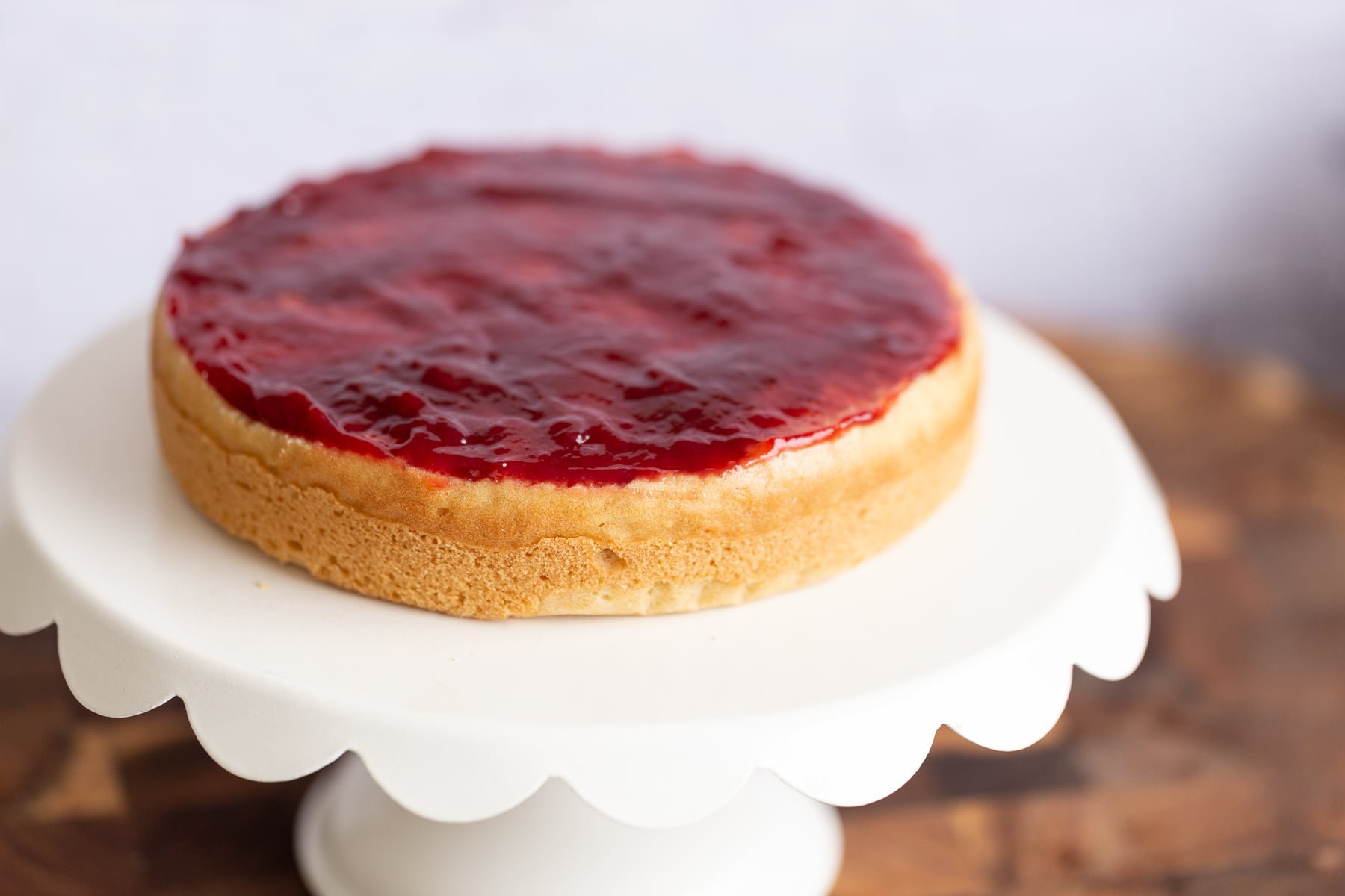 vegan white cake vegan sponge cake topped with raspberry jam