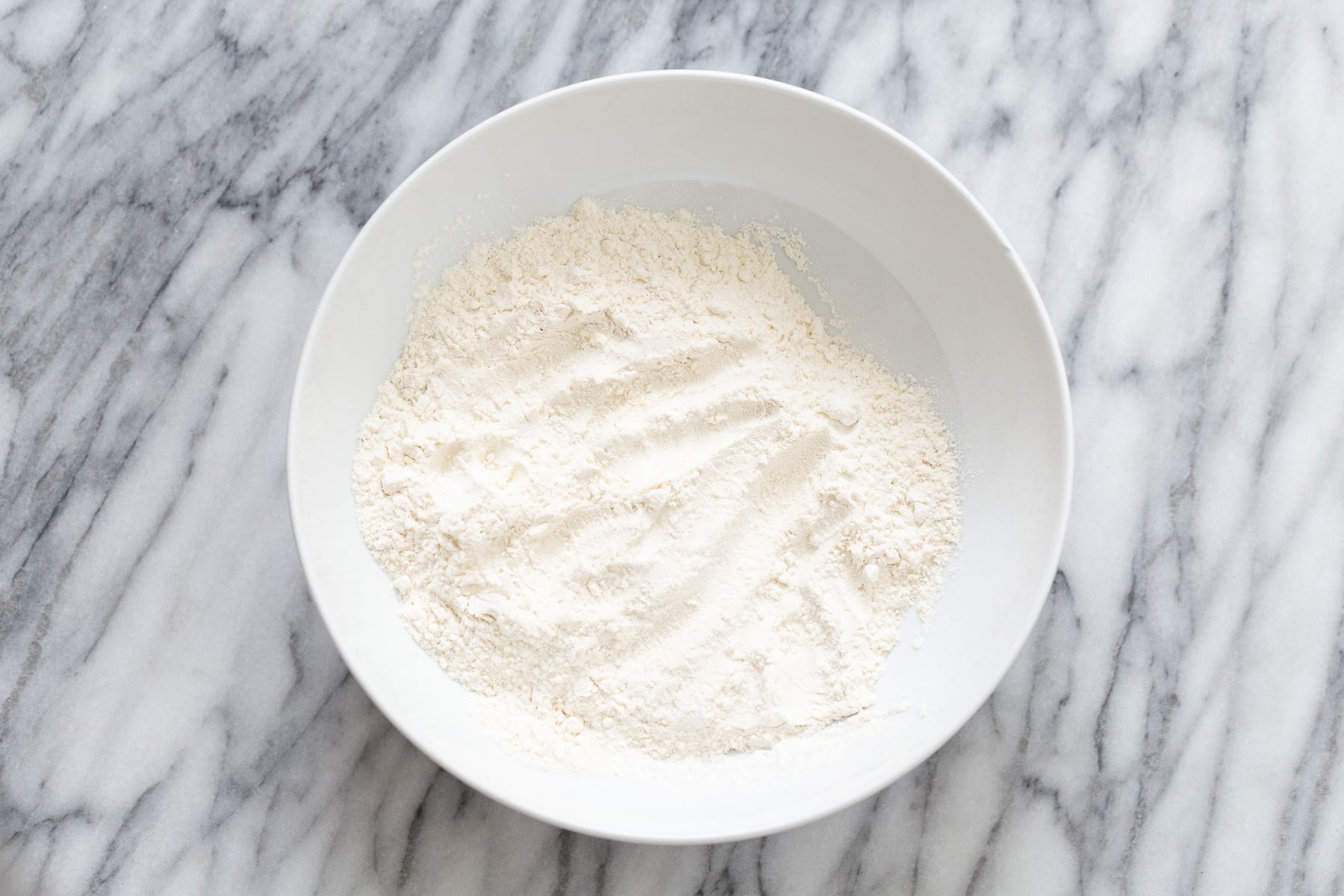 peanut butter and jelly cake dry cake mix in a white bowl