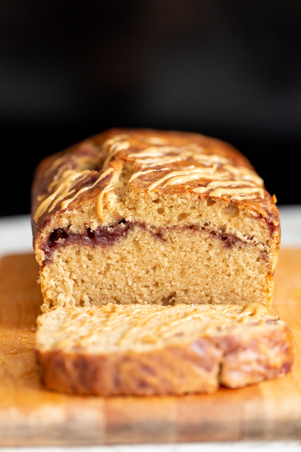 a sliced vegan peanut butter and jelly cake baked in a loaf pan