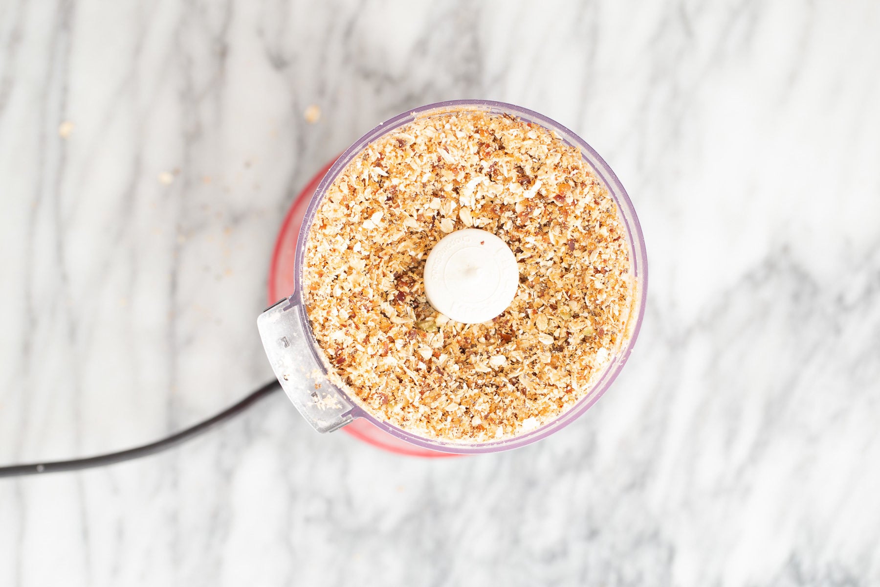 vegan date bars blended nuts and dates in a food processor