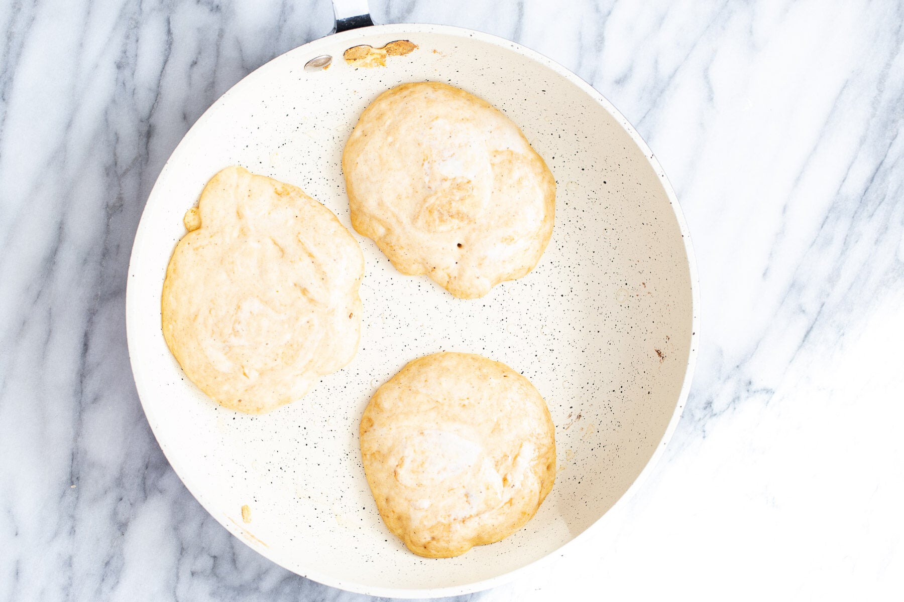 pumpkin pancakes in a frying pan