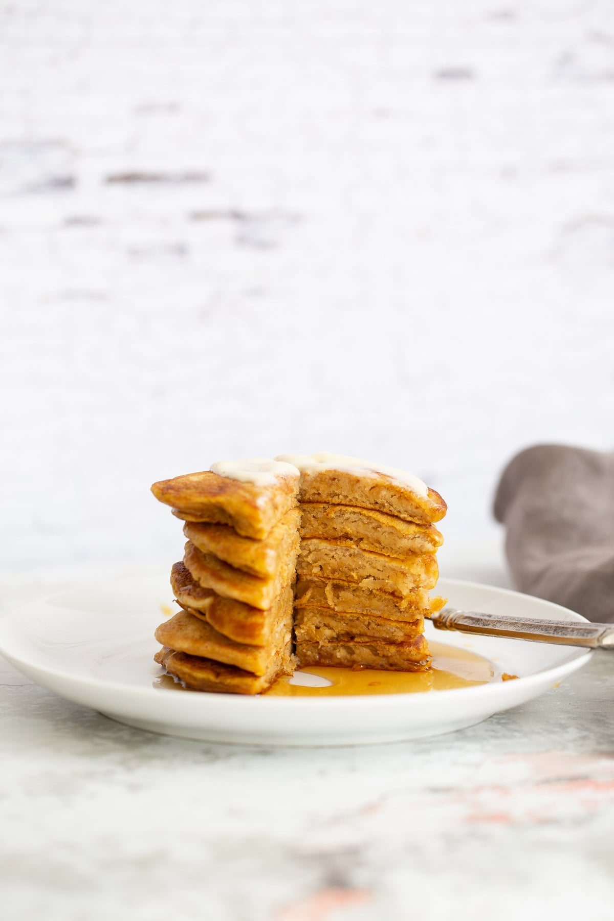 vegan pumpkin pancakes a stack of vegan pumpkin pie pancakes with one wedge cut out