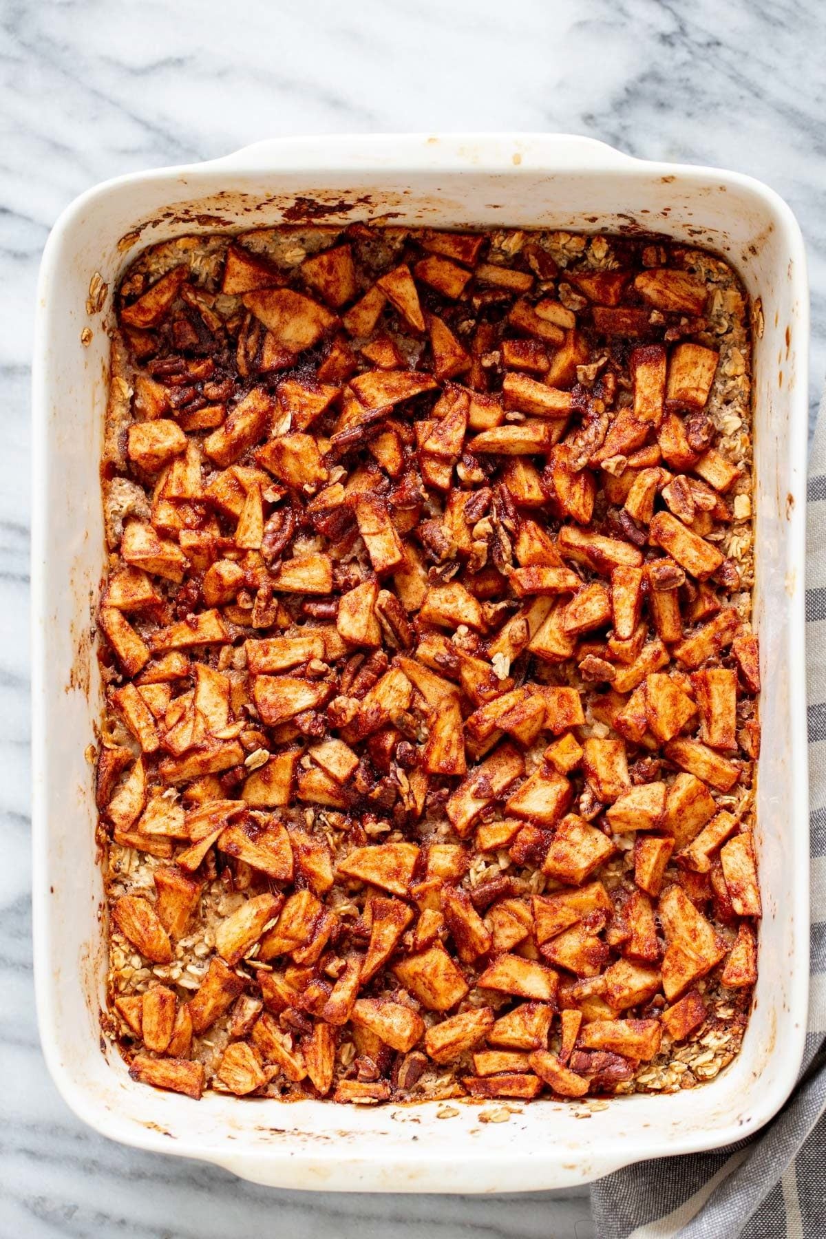 overhead shot of a casserole dish with apple pie baked oatmeal