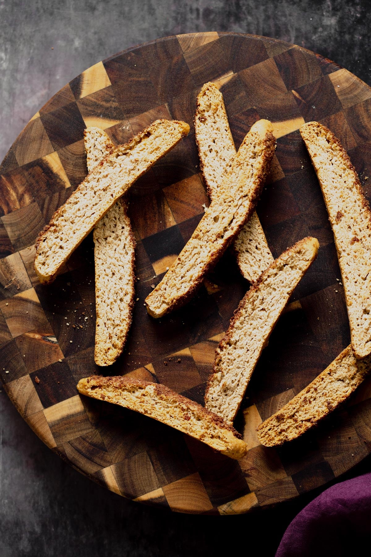 vegan biscotti overhead shot of vegan cinnamon sugar biscotti on a wooden plate