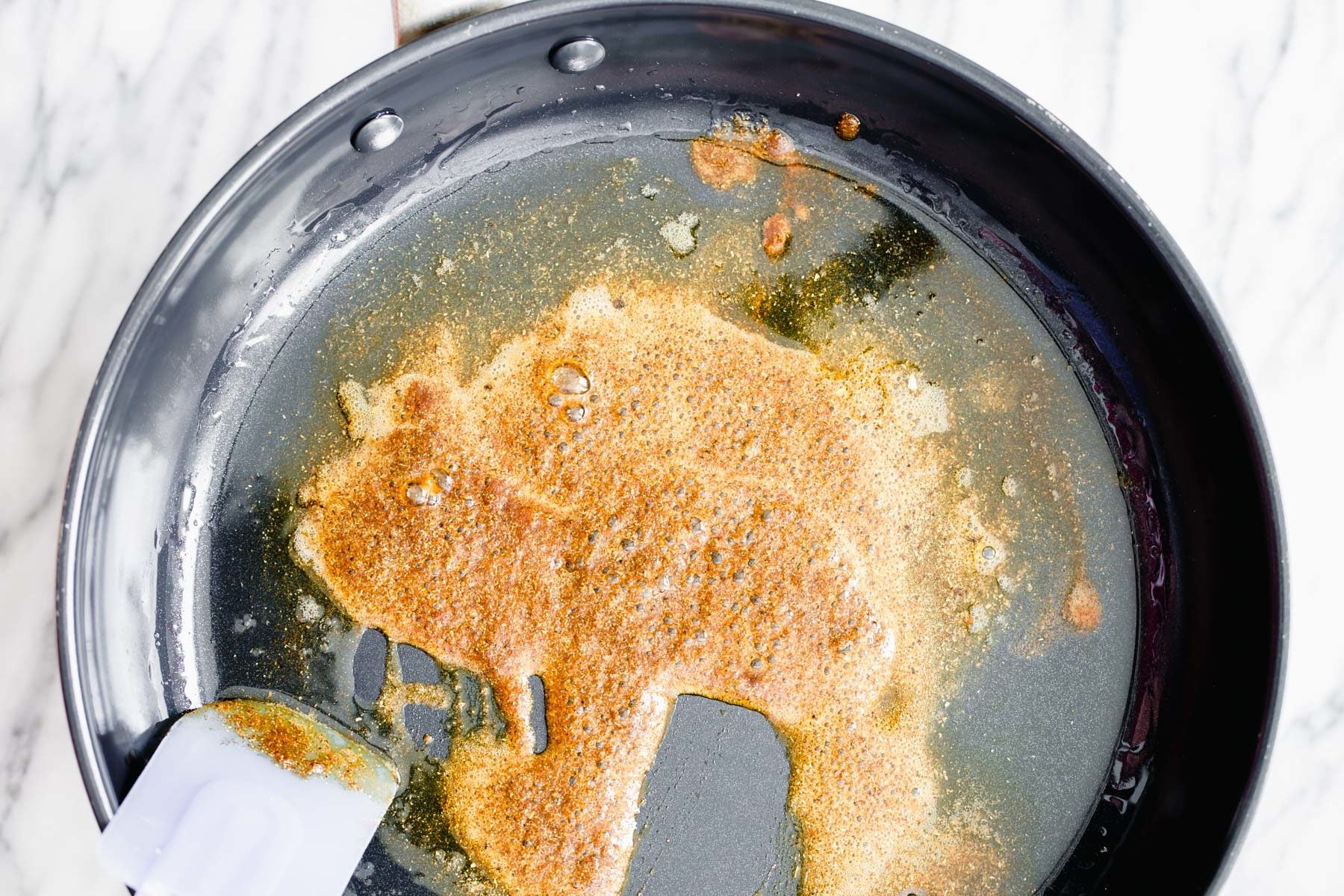 pumpkin curry warming Indian spices being fried in oil to make pumpkin curry