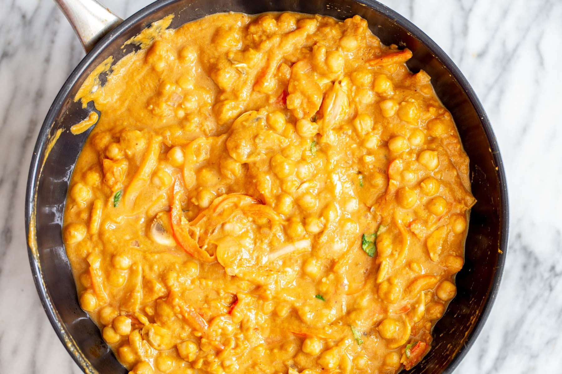 pumpkin curry chickpeas being cooked in pumpkin gravy for making curry