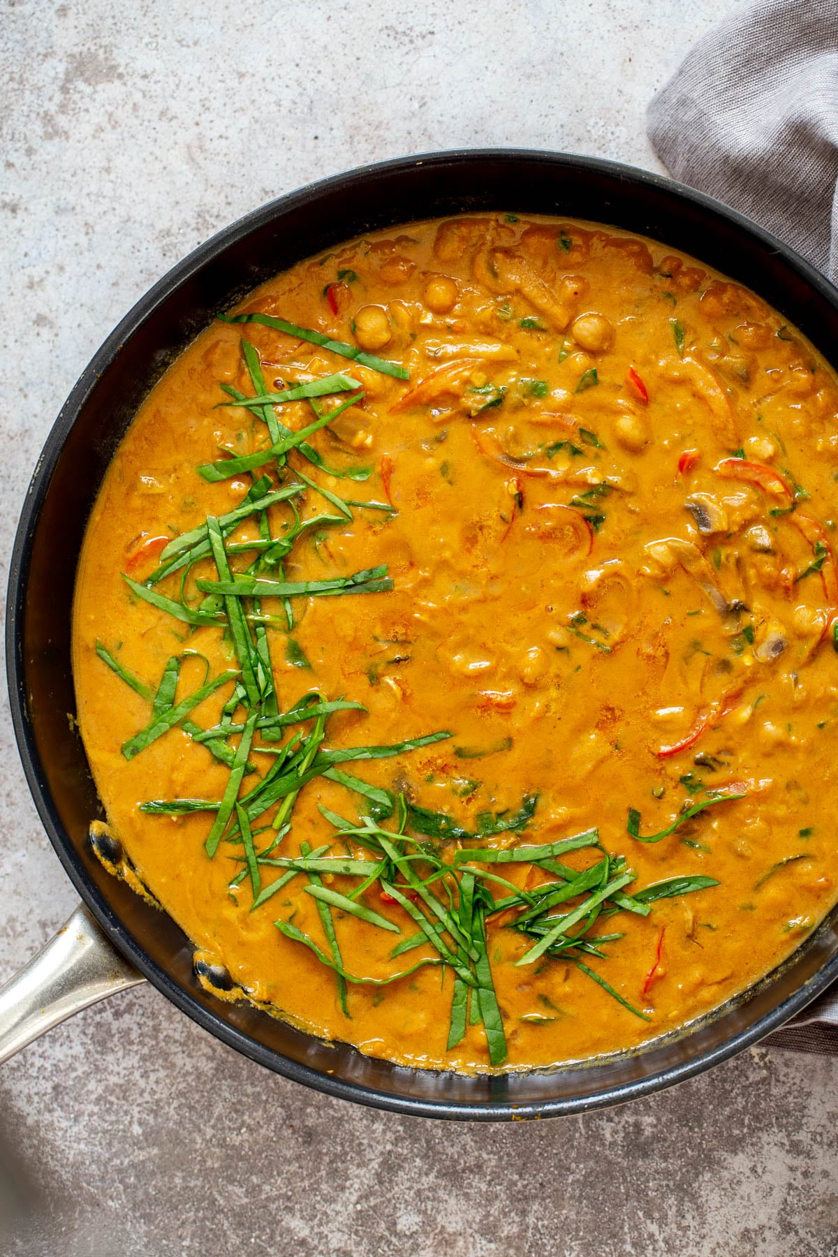 pumpkin curry overhead shot of a skillet with pumpkin chickpea curry