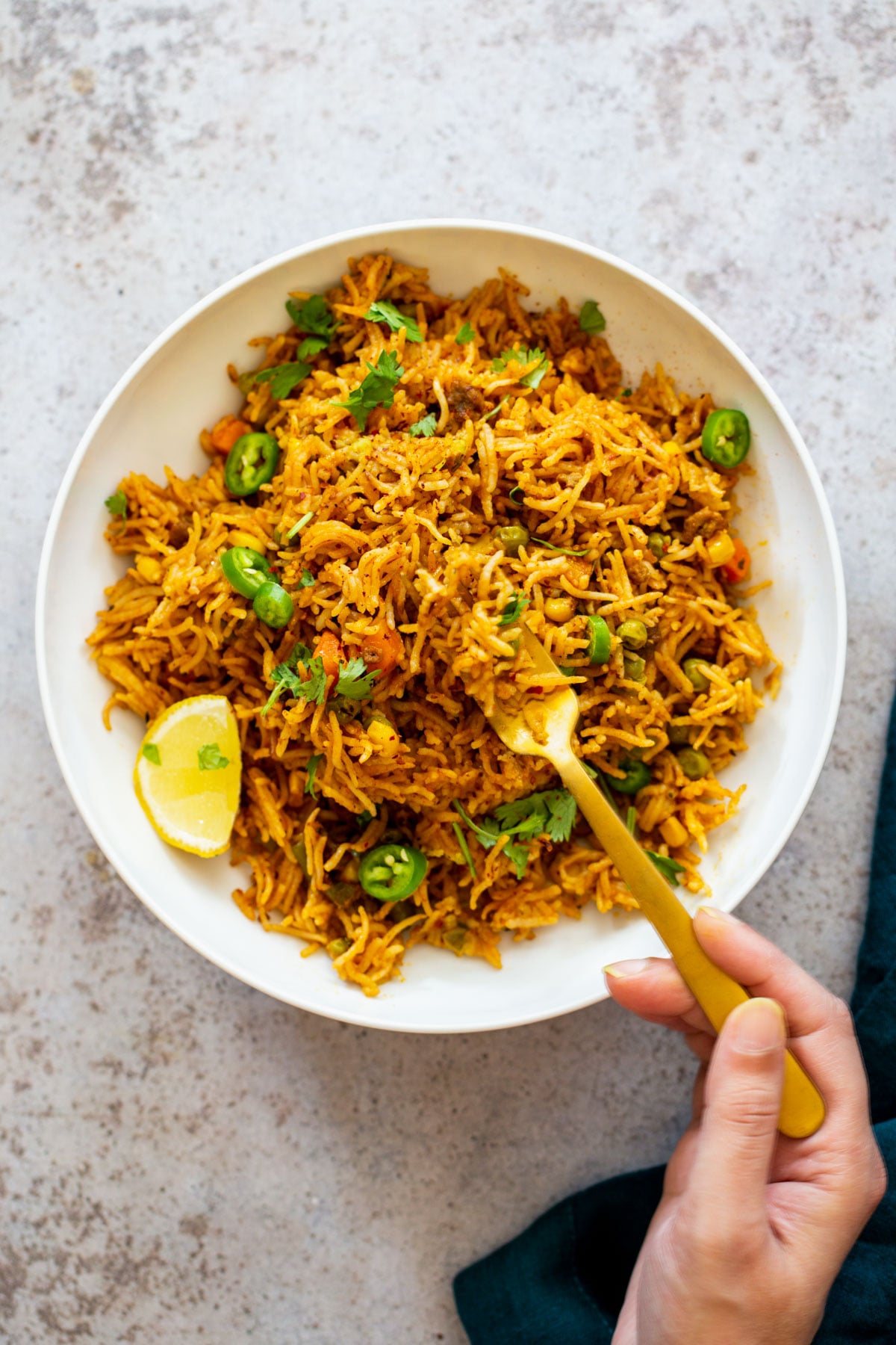 Instant Pot Fried Rice a fork digging into a pile of fluffy chipotle pumpkin fried rice