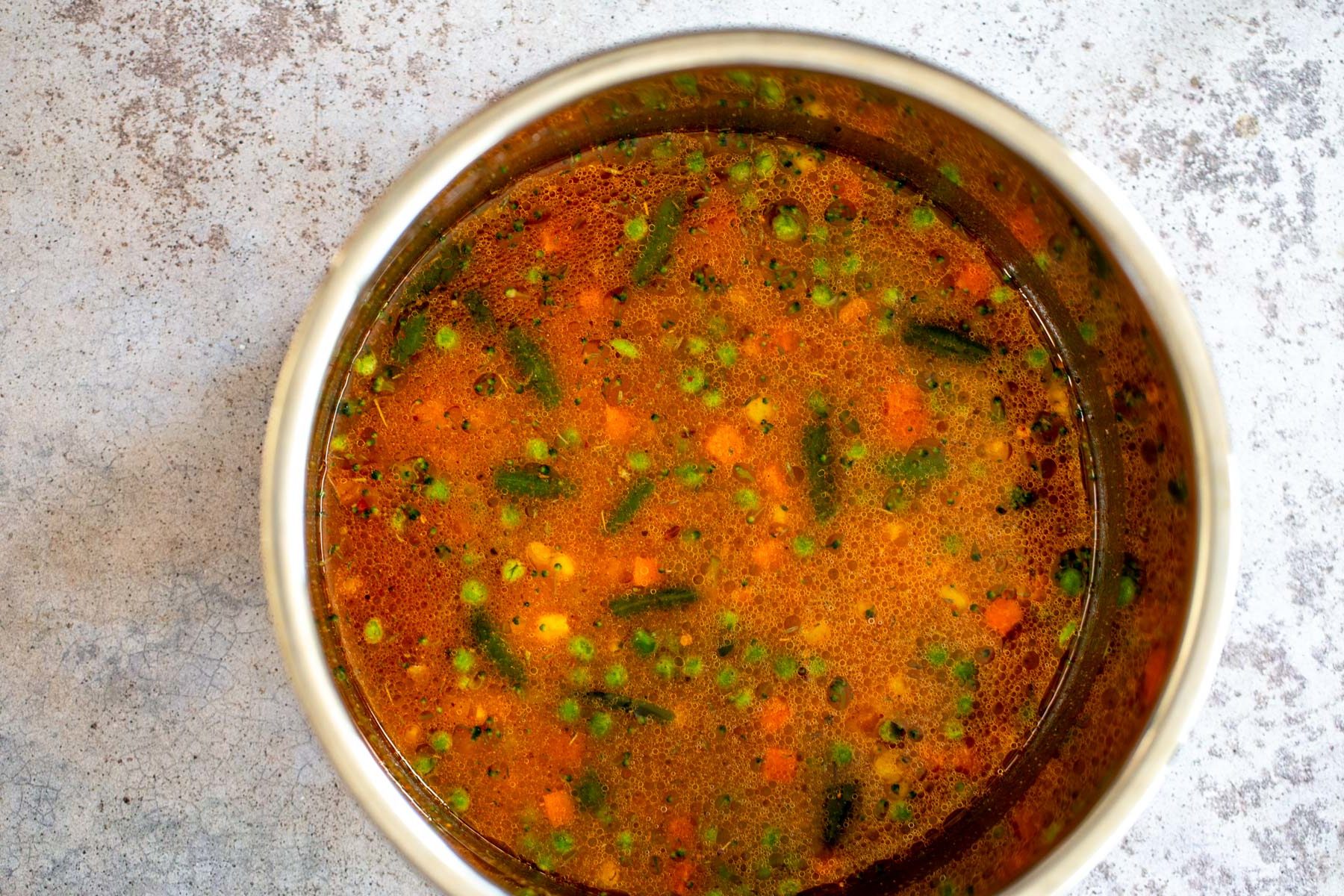 Instant Pot Fried Rice water being added to dry ingredients used for making Instant Pot Fried Rice