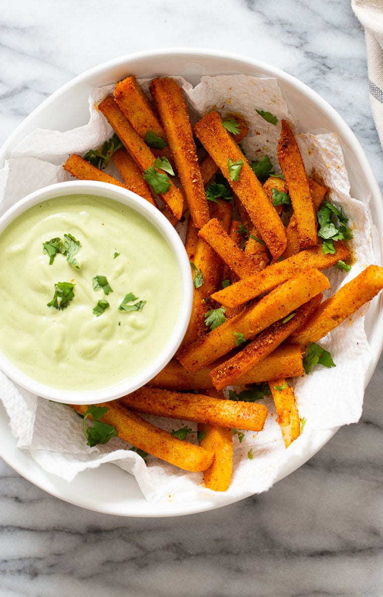 chickpea fries a bowl of Cajun spiced homemade chickpea flour fries served with a cilantro lime dip