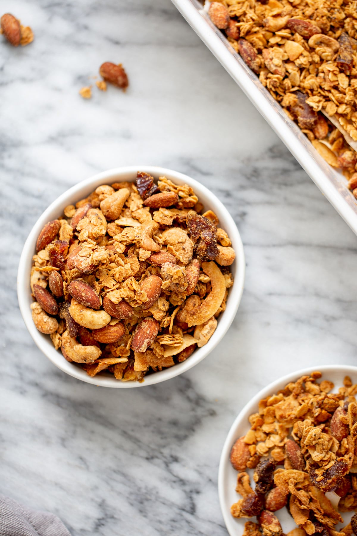 coconut granola two small bowls of homemade almond coconut granola