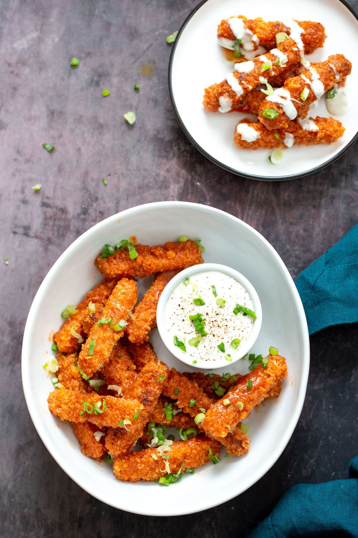 tofu wings two plates with vegan baked firecracker tofu wings served with vegan ranch