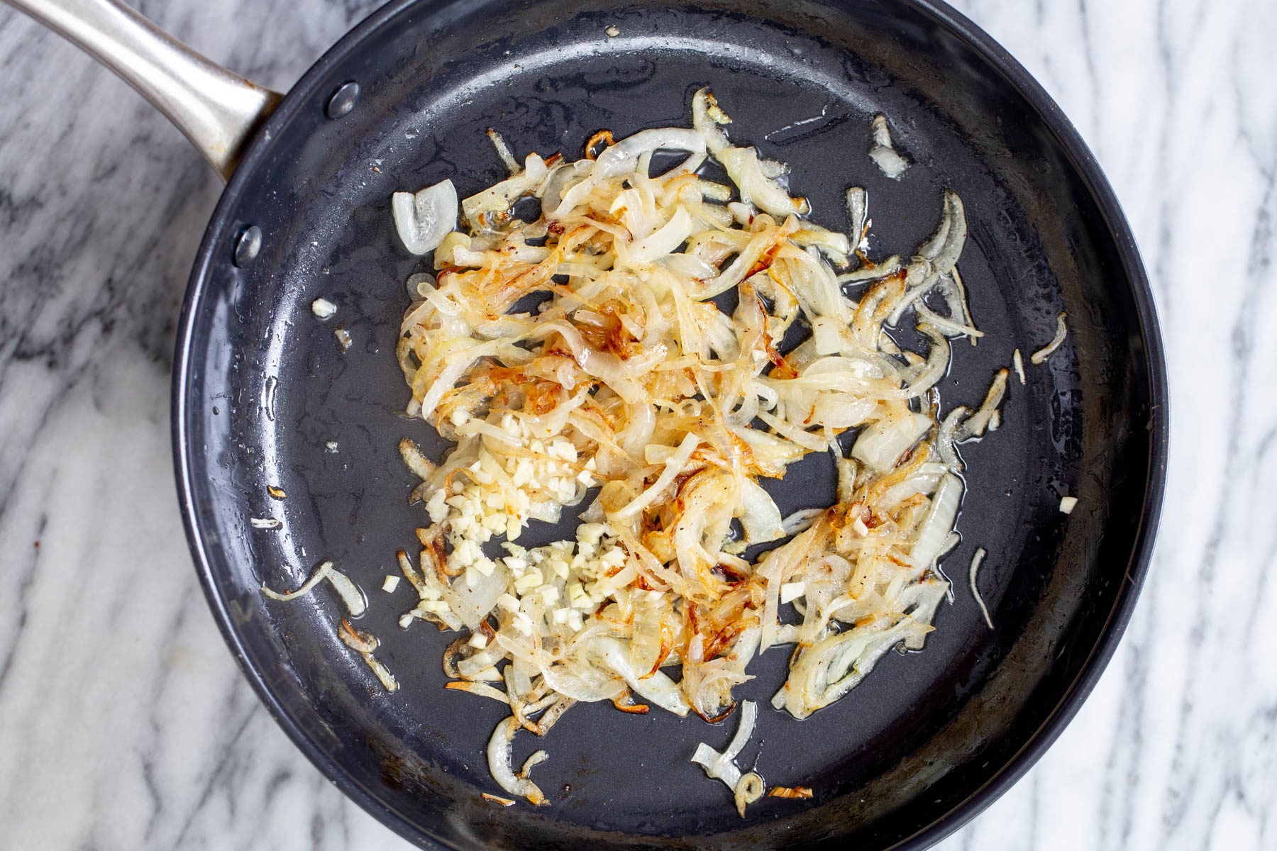 vegan skillet lasagna slightly golden sauteed onion sliced in a skillet