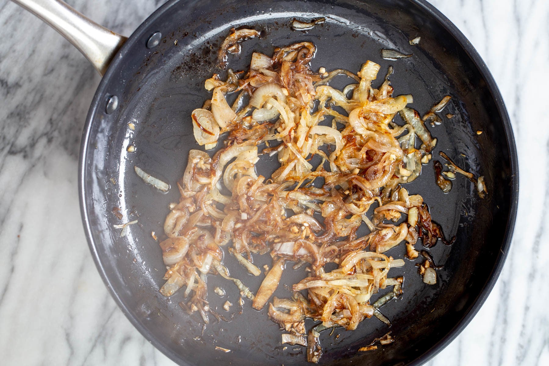 vegan skillet lasagna caramelized browned onion in a black skillet