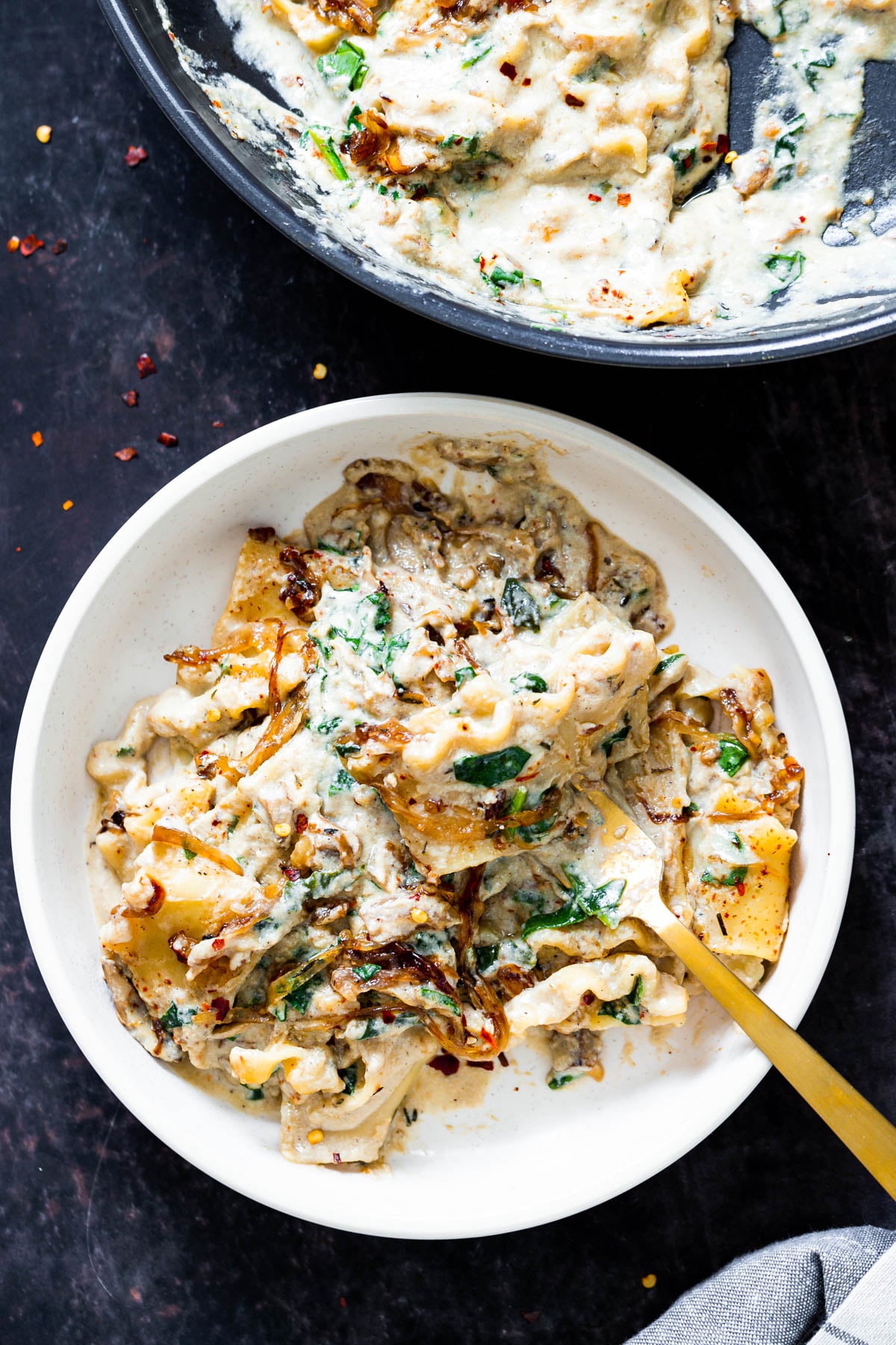 vegan skillet lasagna a bowl of vegan skillet lasagna with a golden fork