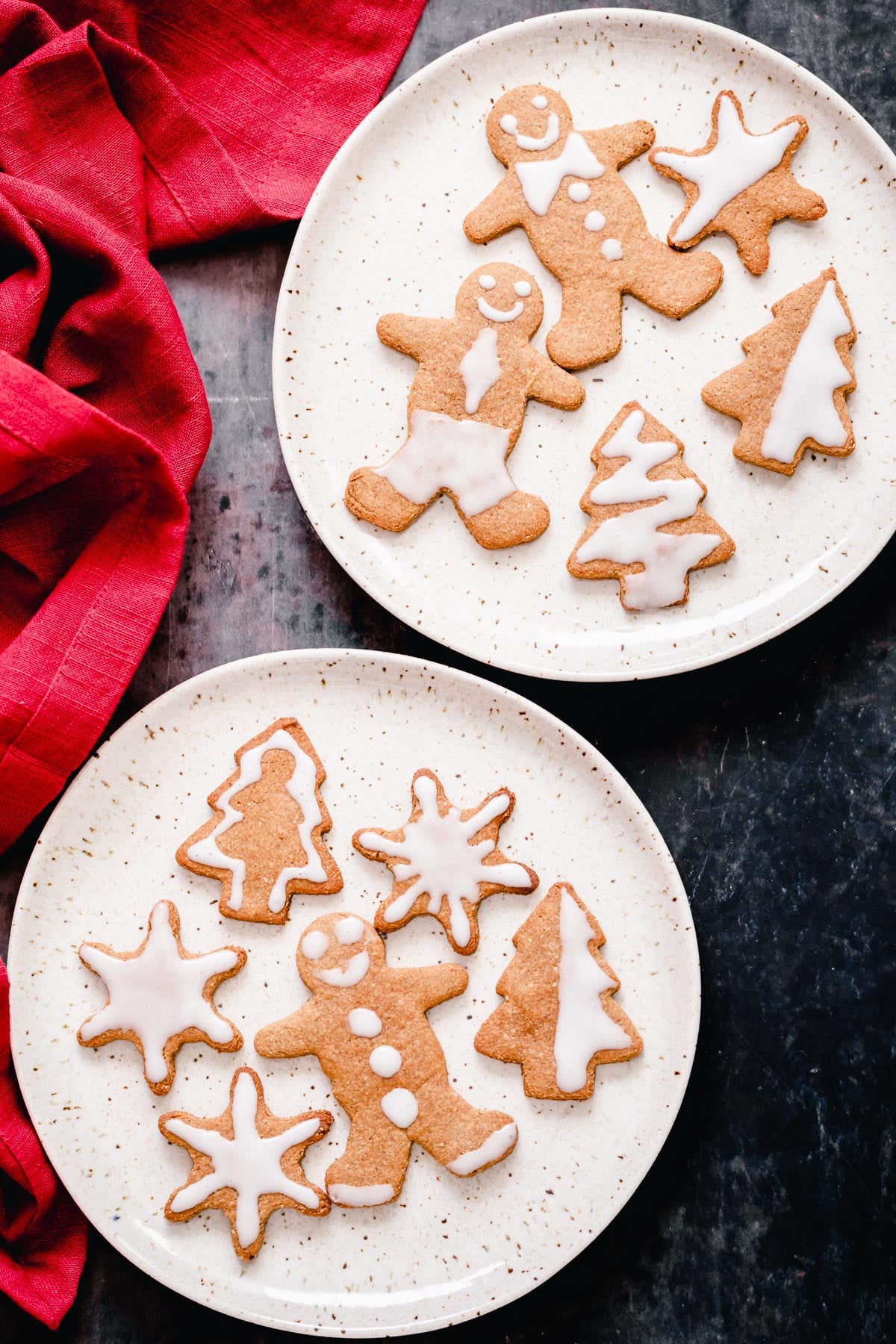 overhead shot of two plates of gluten-free grain-free holiday gingerbread cookies 