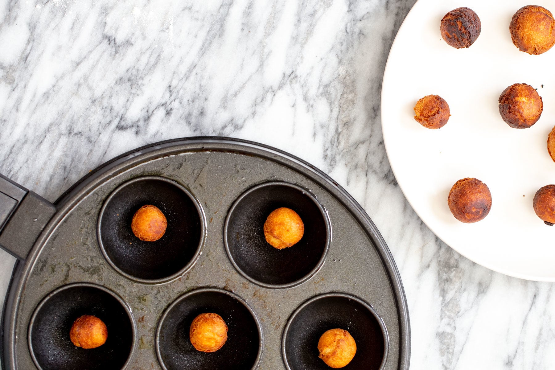 vegan gulab jamun homemade vegan gulab jamun donuts being made in an appe pan