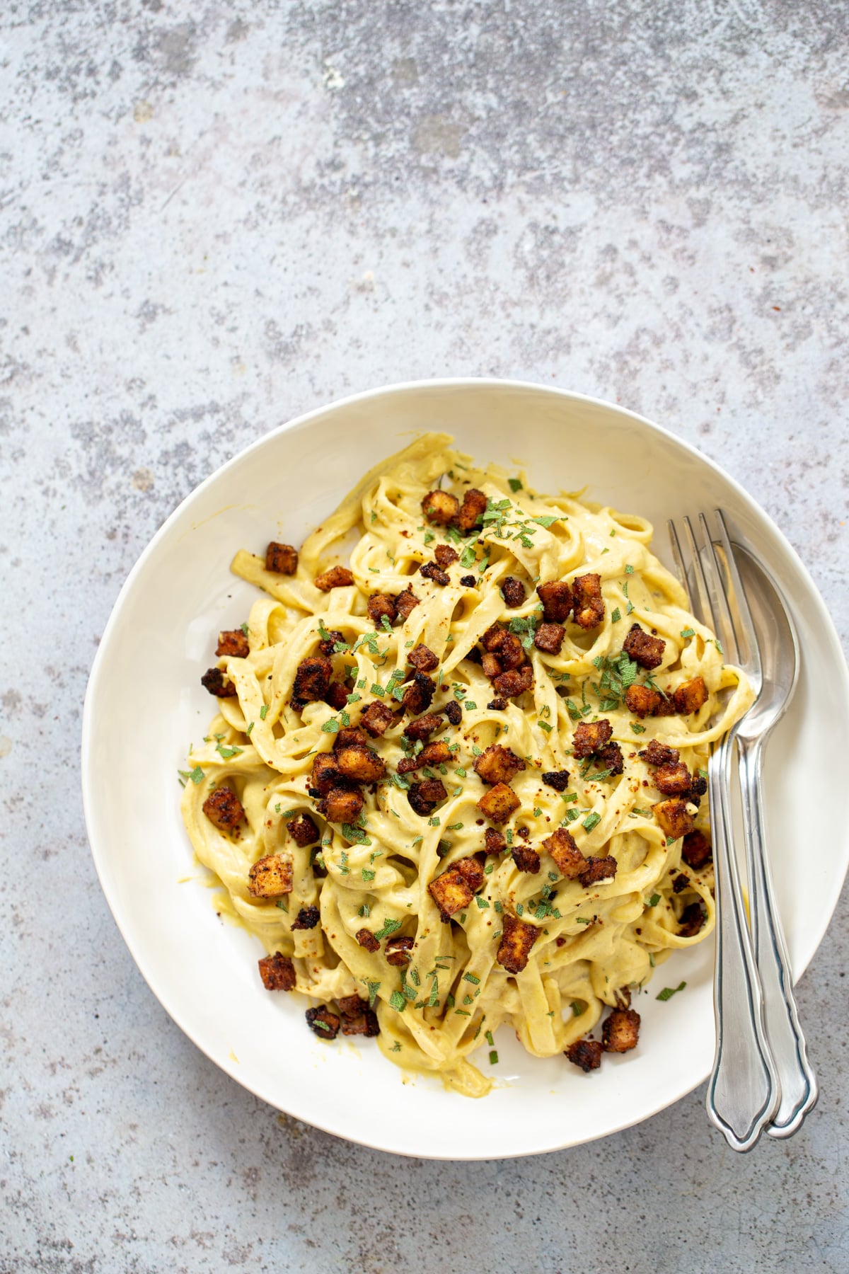 butternut squash carbonara overhead shot of a vegan Butternut Squash Carbonara Pasta served with roasted tofu