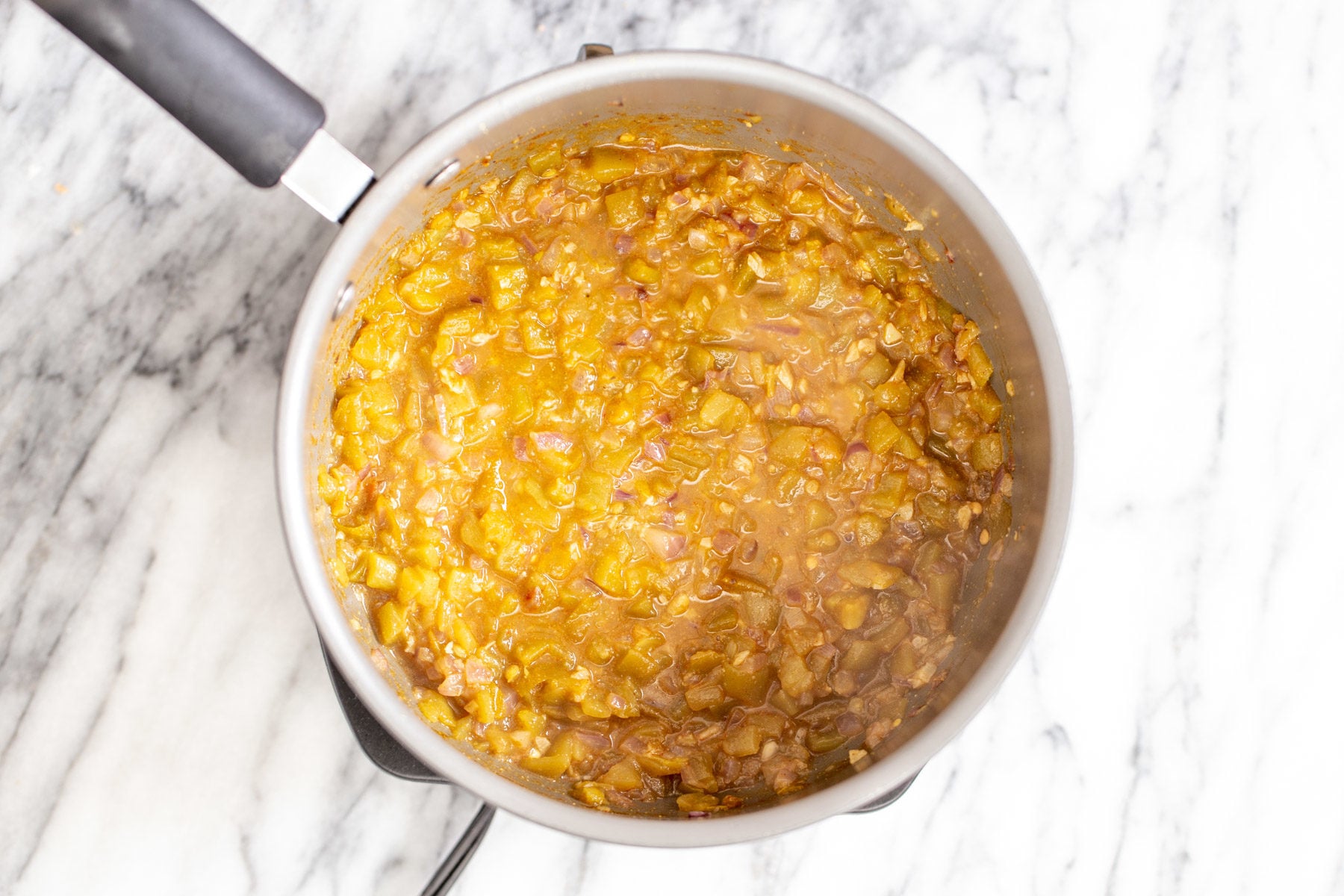vegan enchilada soup cooking in a sauce pan 