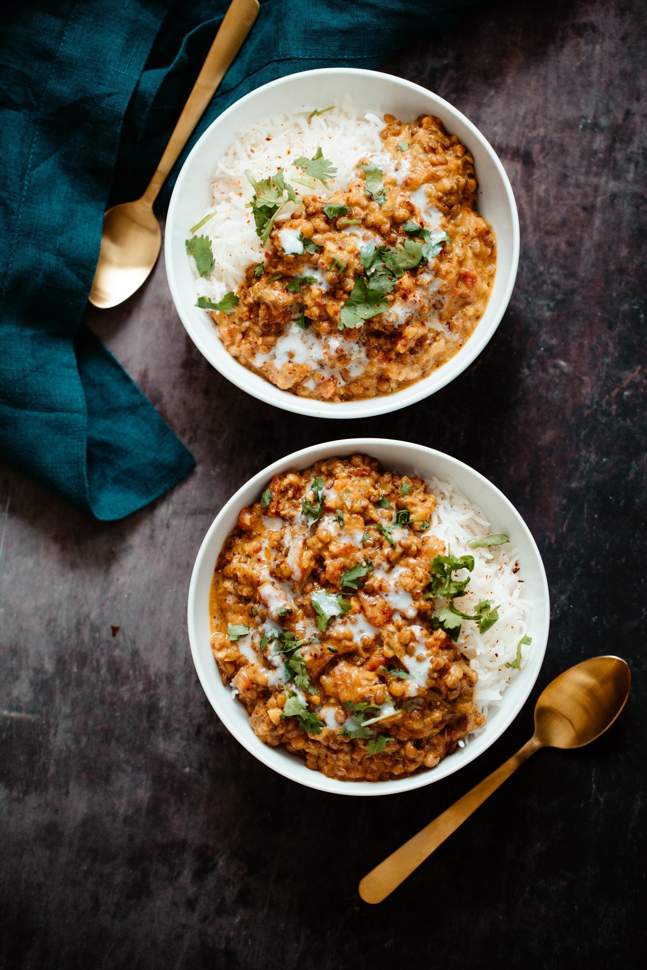 lentil casserole two bowls with rice topped with creamy coconut curry lentil casserole
