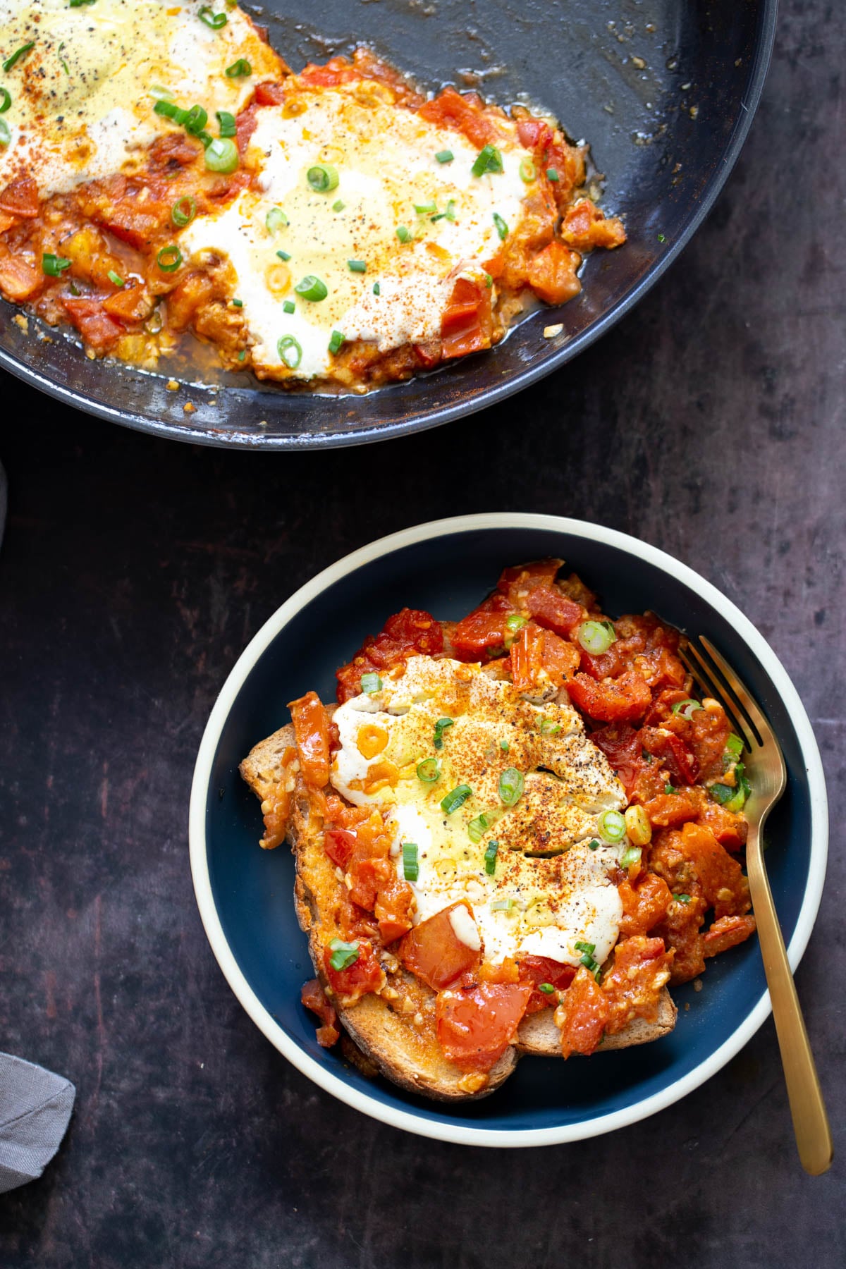 overhead shot of two servings of vegan eggs in purgatory made with tofu eggs