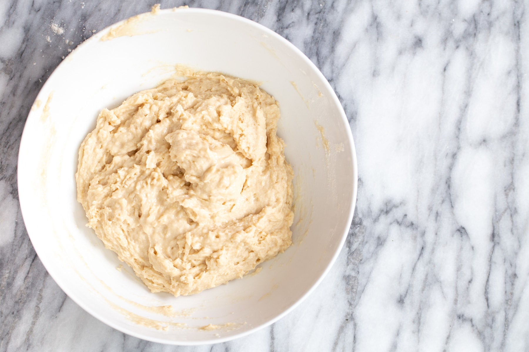 lamington donuts vegan lamington donut batter being mixed in a bowl