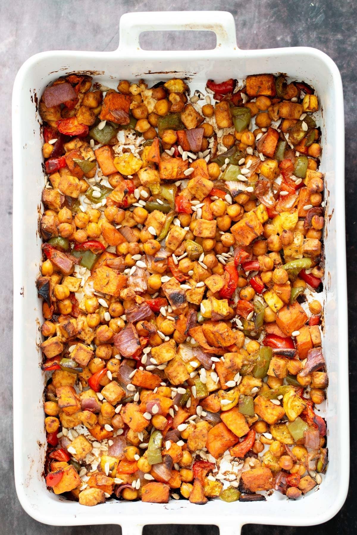 freshly baked cheeseburger sheet pan dinner baked in a casserole dish 