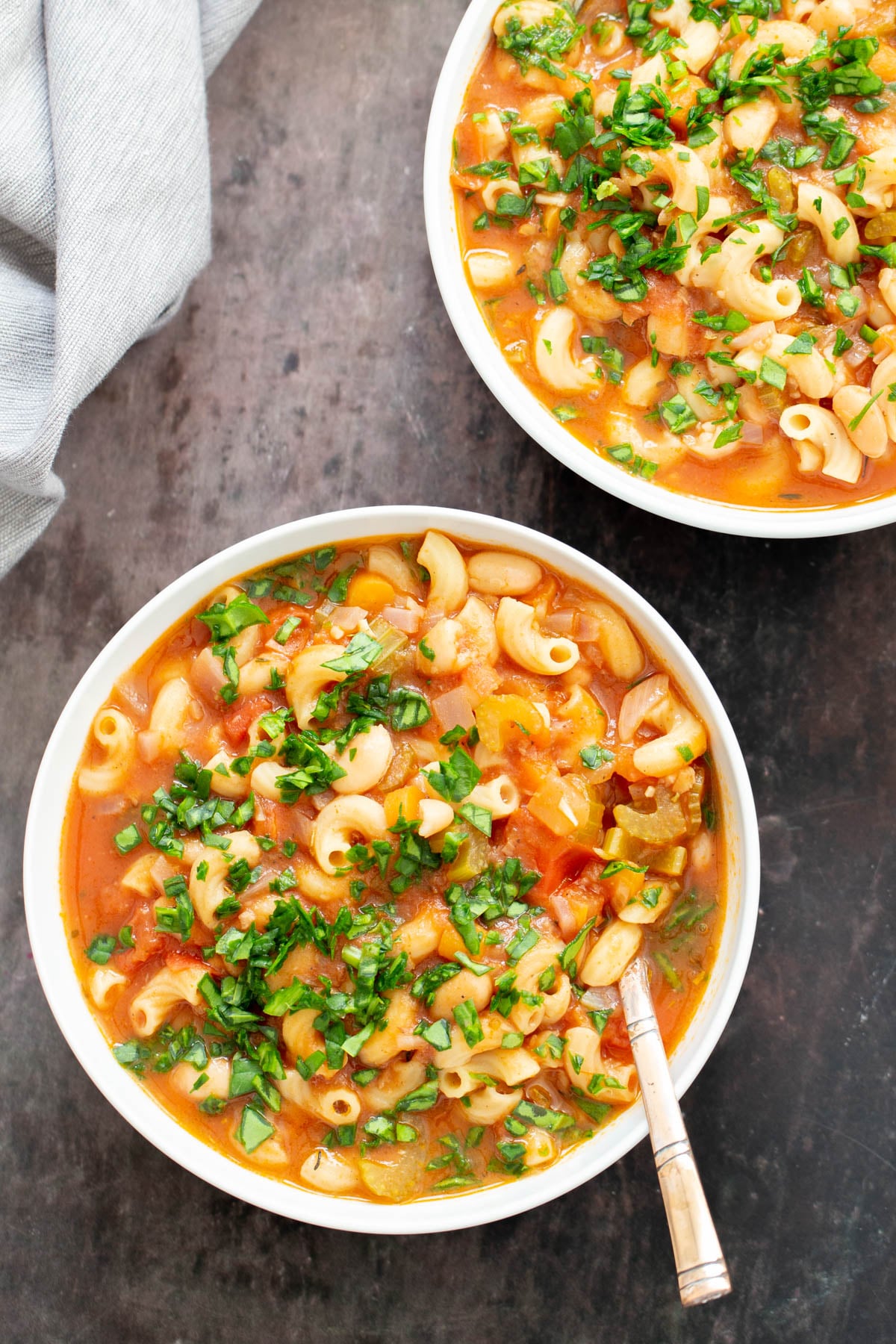vegan pasta e fagioli overhead shot of two bowls of vegan pasta e fagioli soup