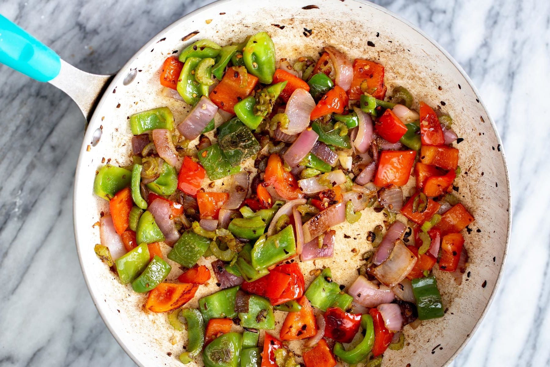 overhead shot of a frying pan with with sauteed vegetables