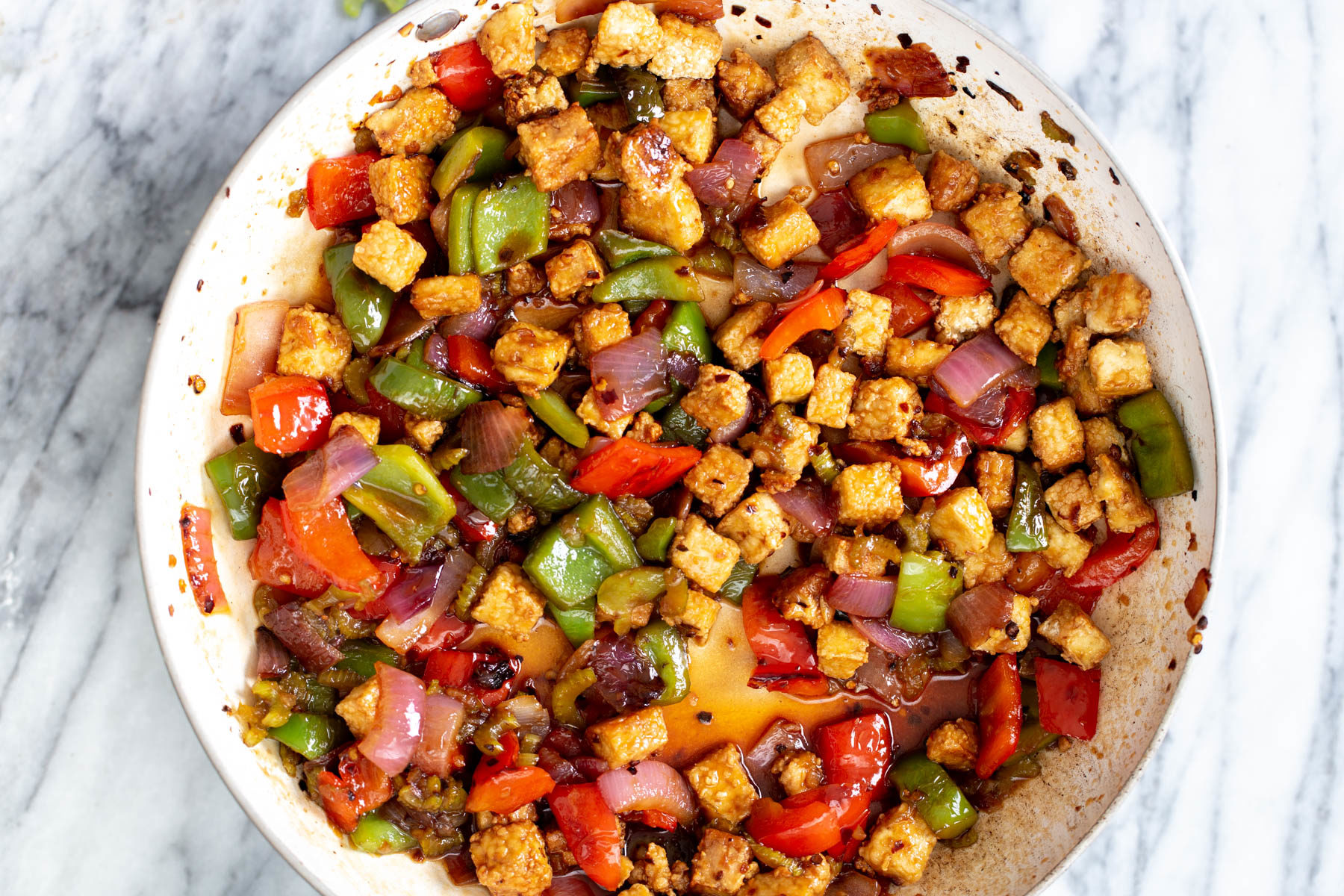 A sauteeing pan with sweet and sour tofu stir-fry