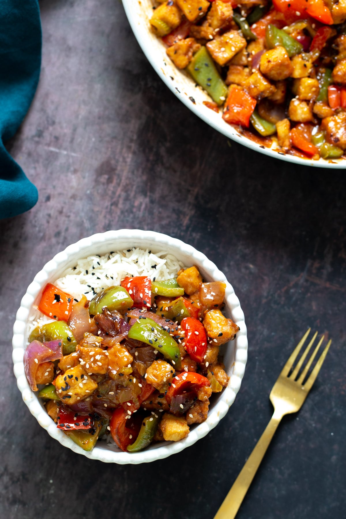 sweet and sour tofu overhead shot of a bowl with rice topped with sweet and sour tofu