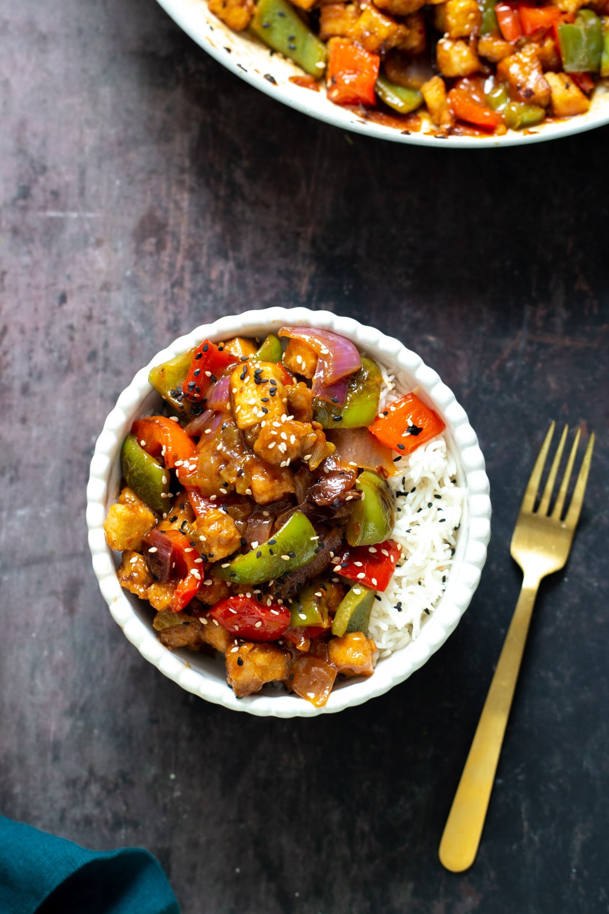 a serving of vegan sweet and sour tofu stir fry served with rice