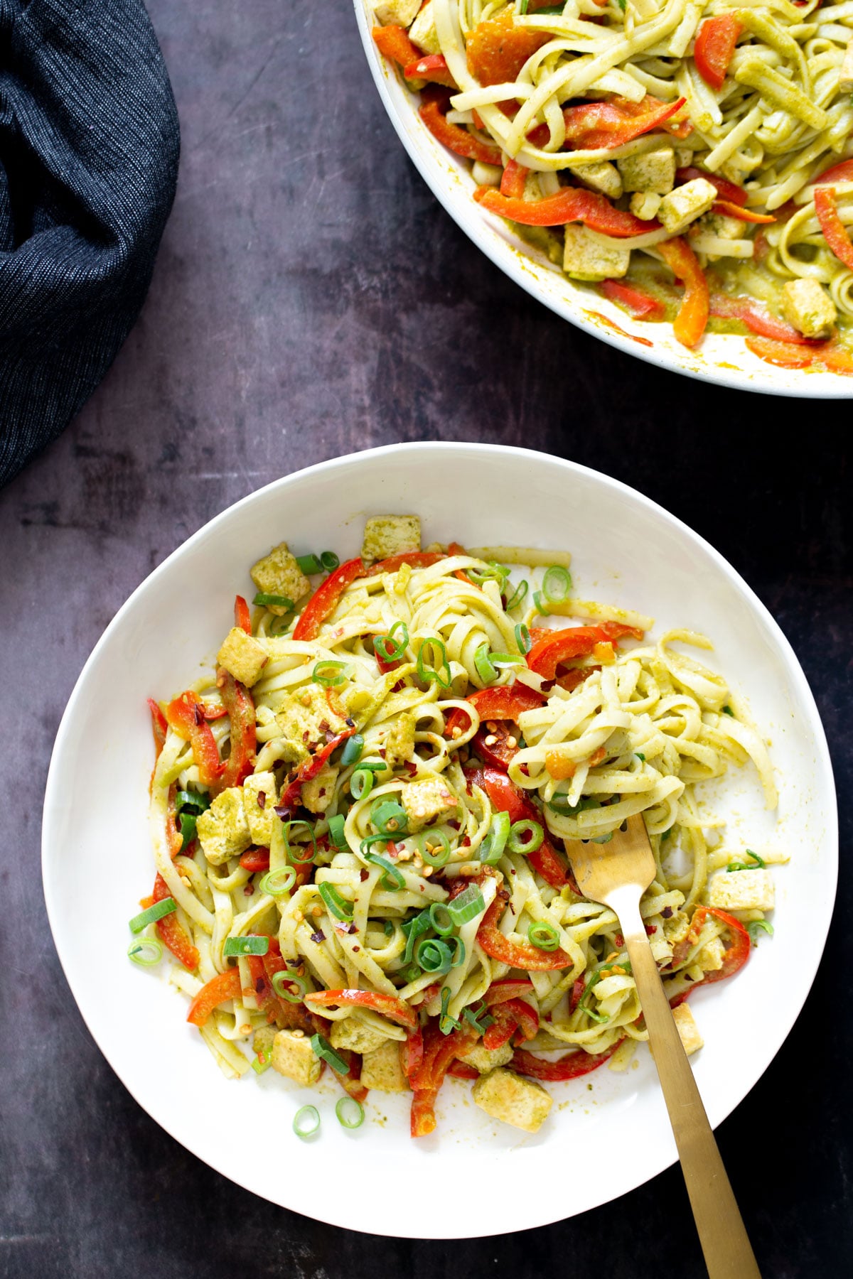 Thai Green Curry Noodles two bowls of thai green curry noodles with pan-fried tofu cubes