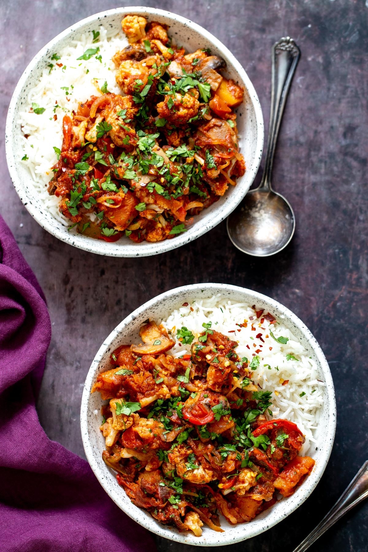 vegetable balti overhead shot of two servings of vegetable balti served with rice