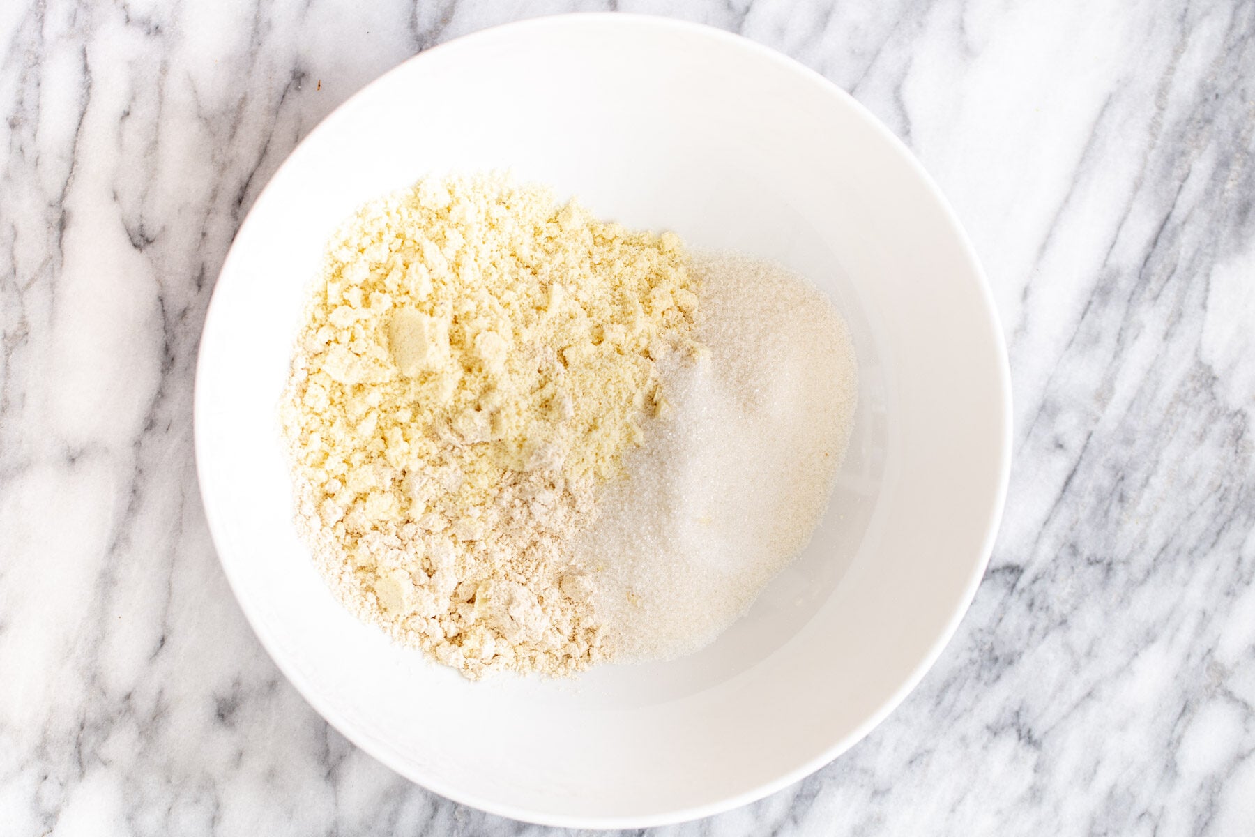 vegan lemon bars dry ingredients for lemon bars in a small bowl