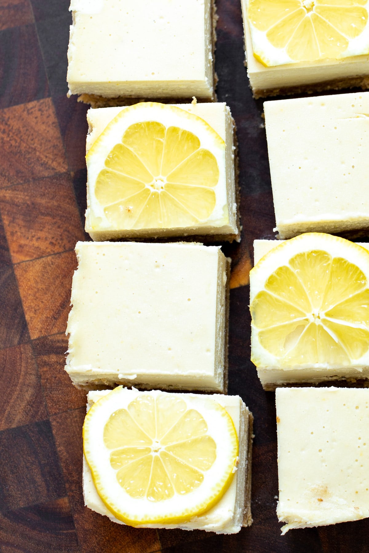 vegan lemon bars freshly cut vegan lemon bars topped with lemon slices