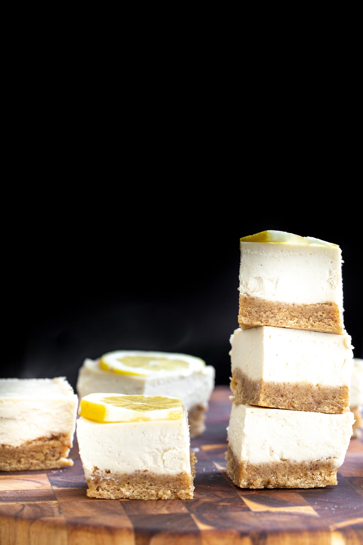 vegan lemon bars vegan lemon bars on a wooden chopping board