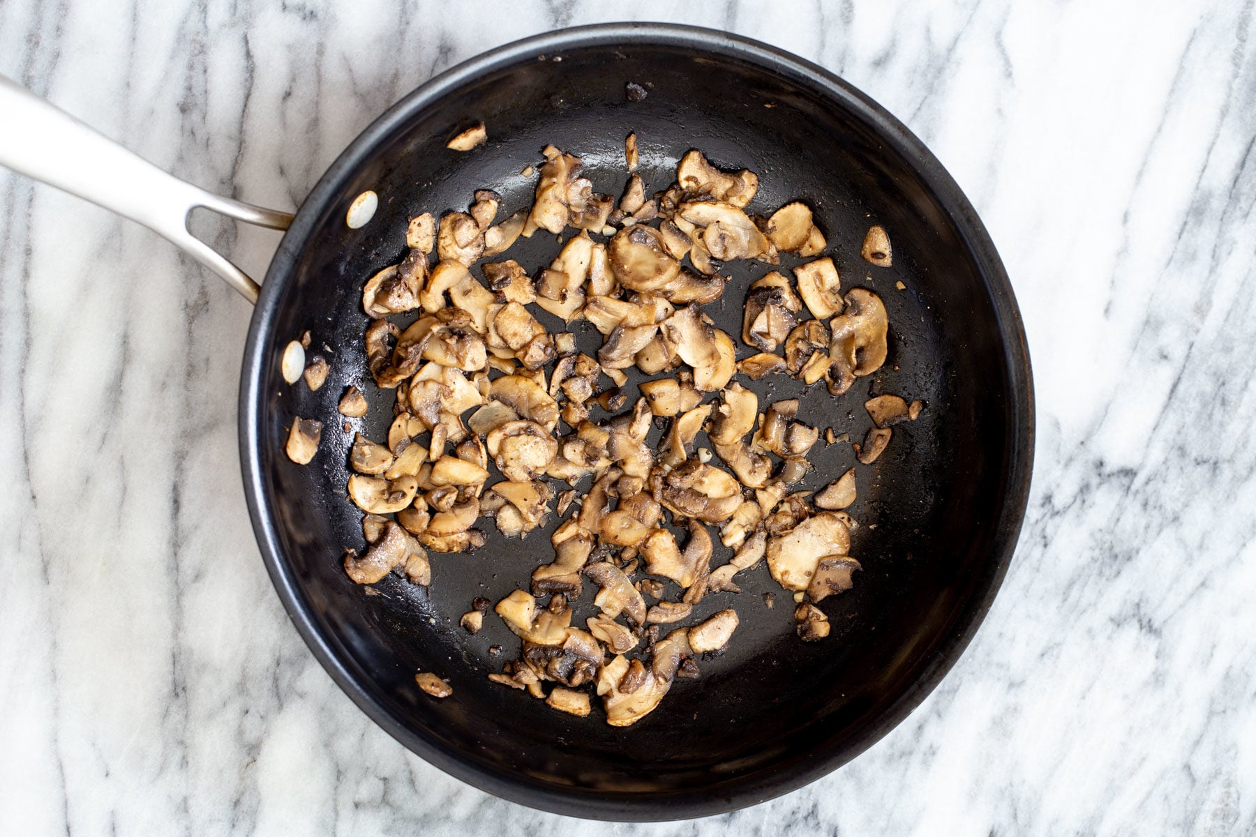 sauteed mushrooms in a frying pan