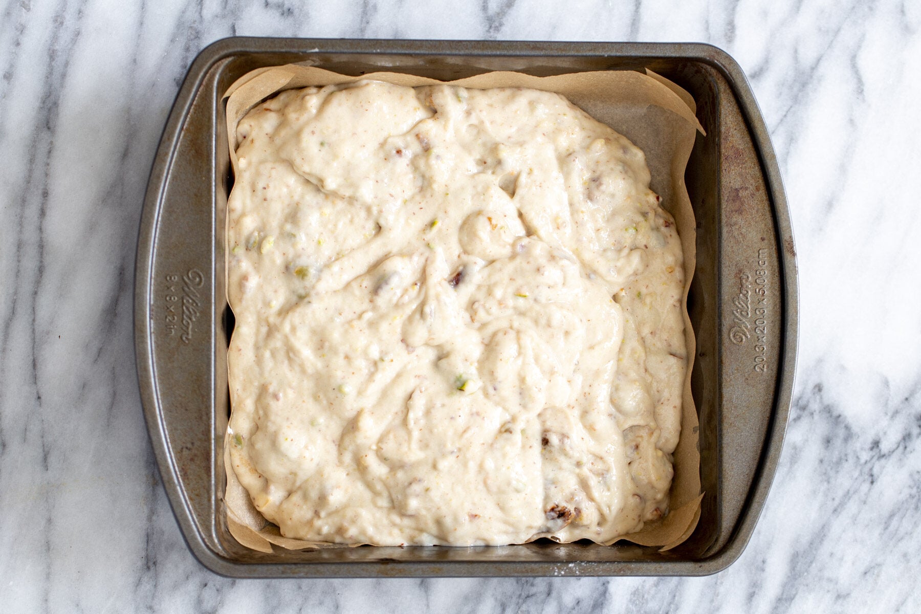 date nut cake vegan date nut cake batter in a cake pan