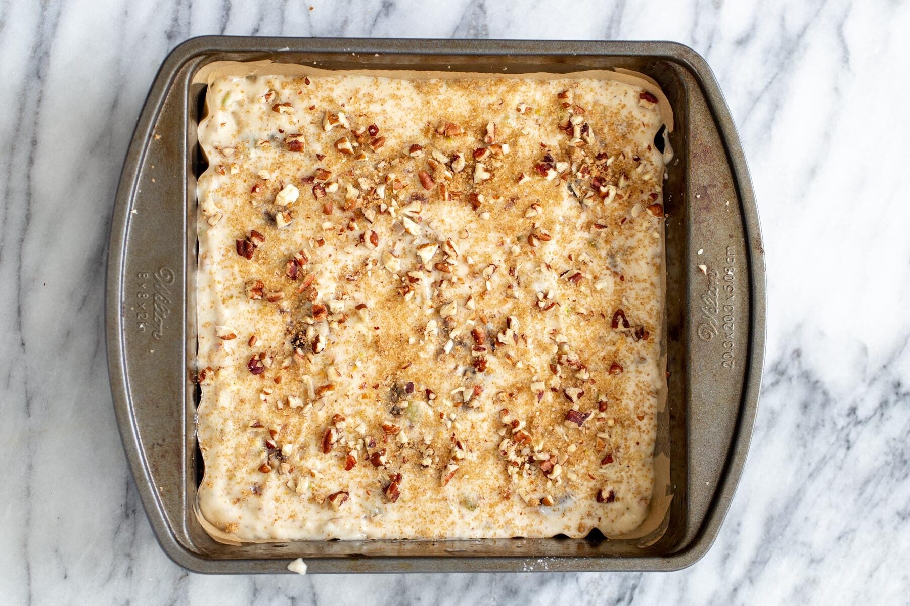 date nut cake vegan date nut cake batter in a cake pan ready to be baked