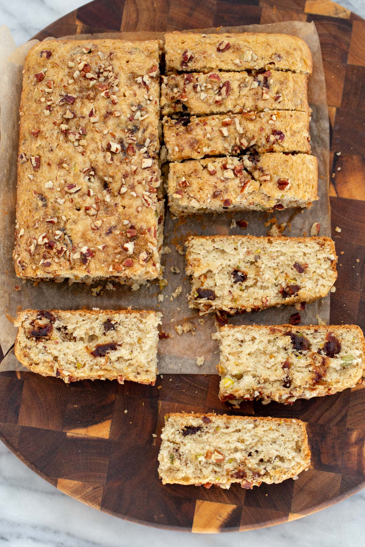 date nut cake vegan date nut cake cut on a wooden chopping board