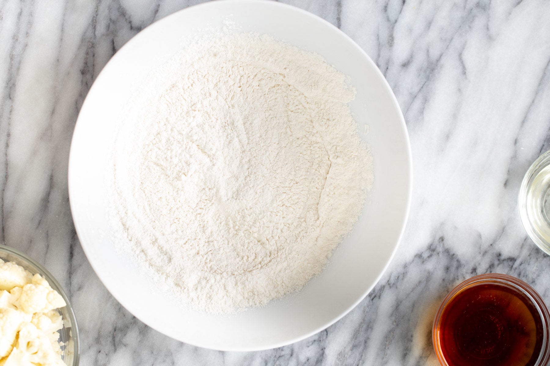 cauliflower manchurian dry mix for cauliflower manchurian batter in a white bowl