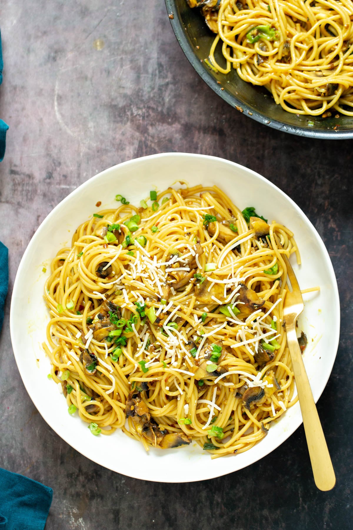 vegan garlic noodles vegan garlic noodles served on a white plate with a golden fork