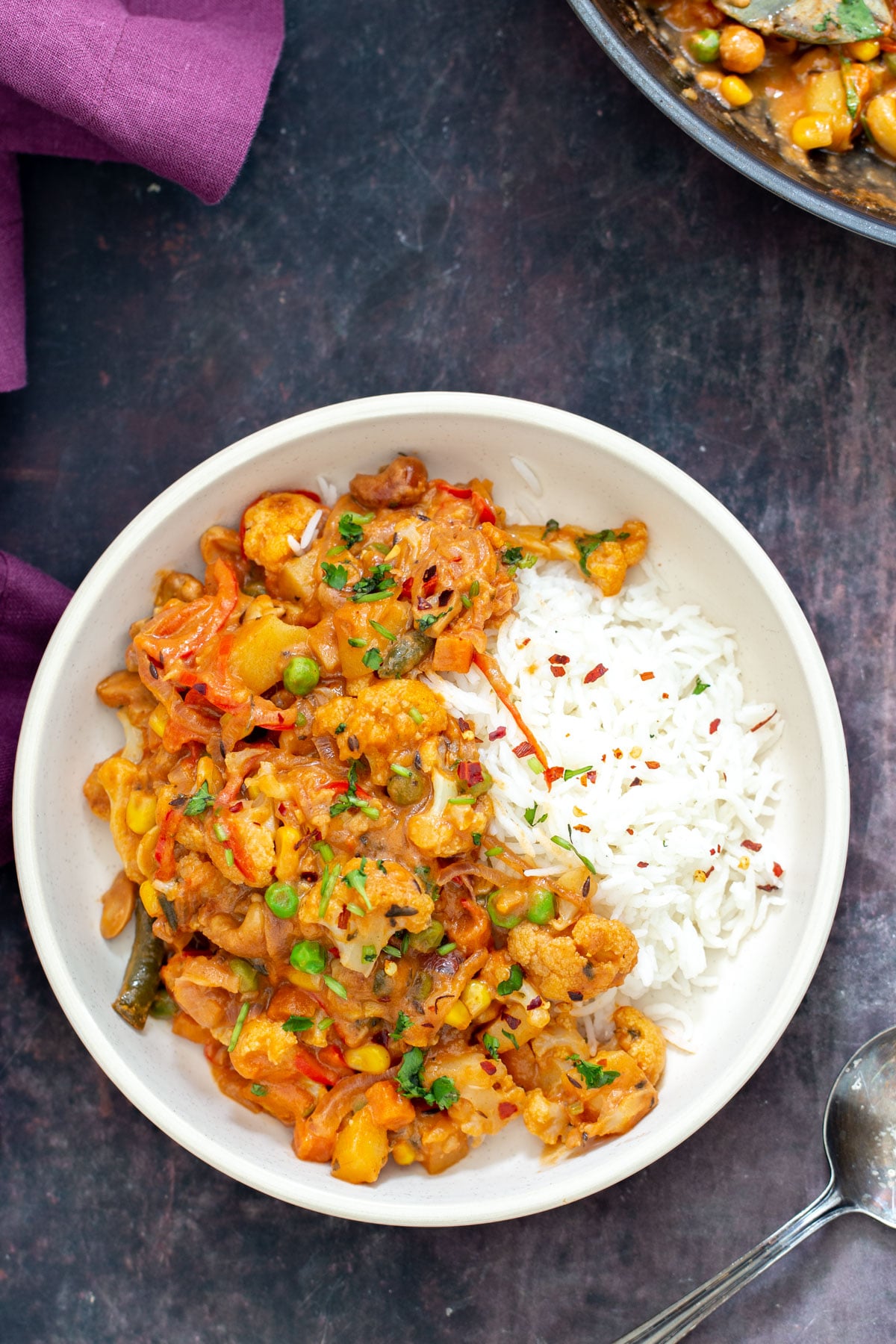 diwani handi diwani handi vegetables in a white bowl served with a side of rice