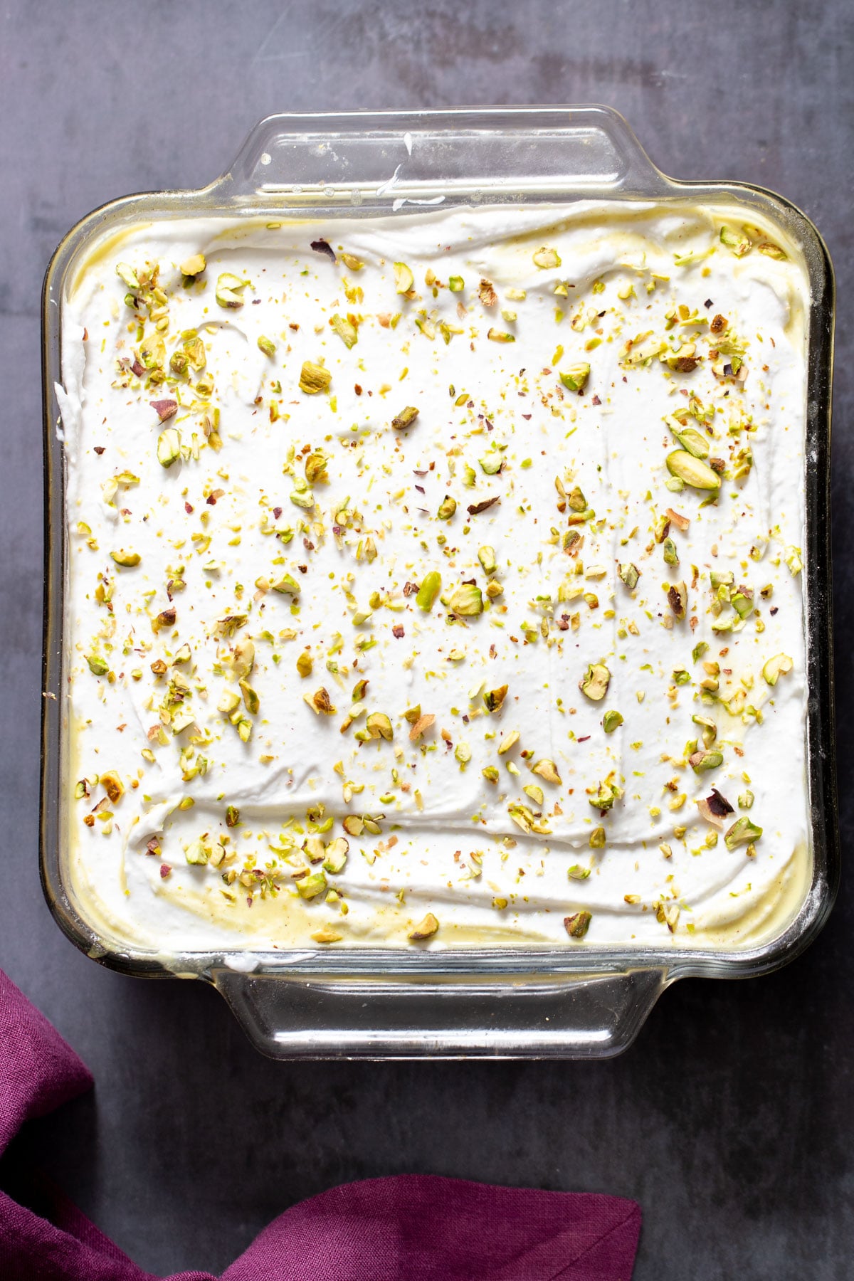 vegan ras malai tres leches in a pyrex loaf pan