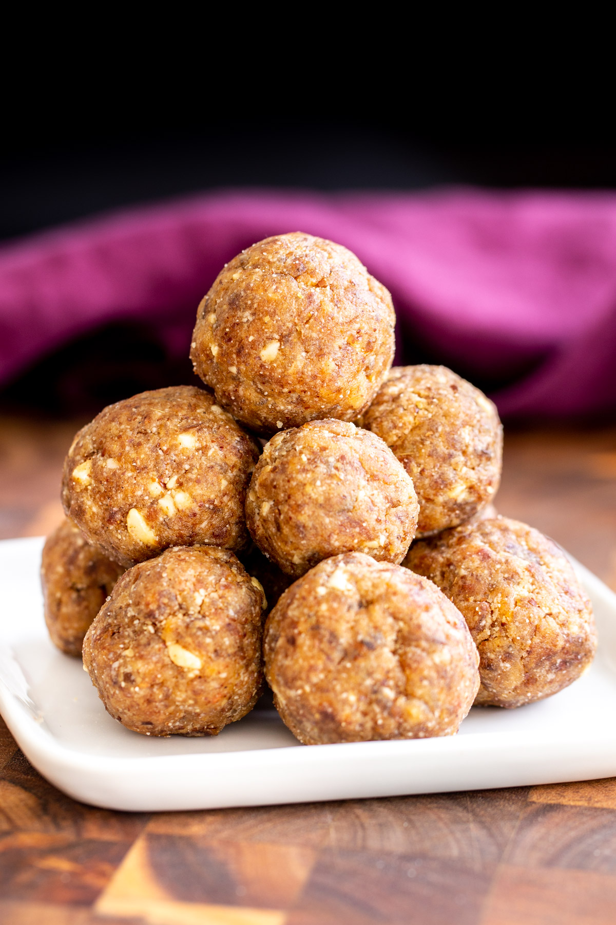 date ladoo vegan whole wheat date ladoo on a small plate